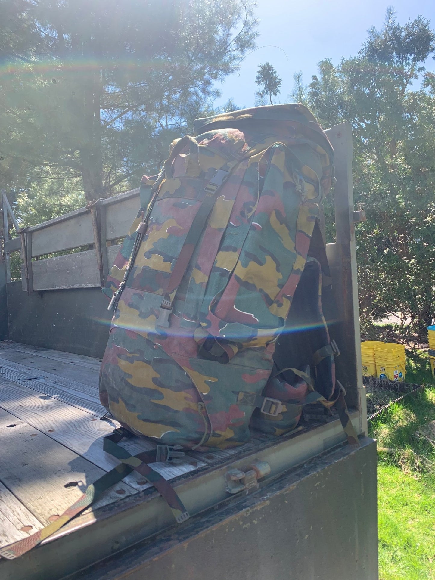 Belgian M97 rucksack jigsaw camouflage, front aspect, sitting on truck, unimog, day pack, hiking